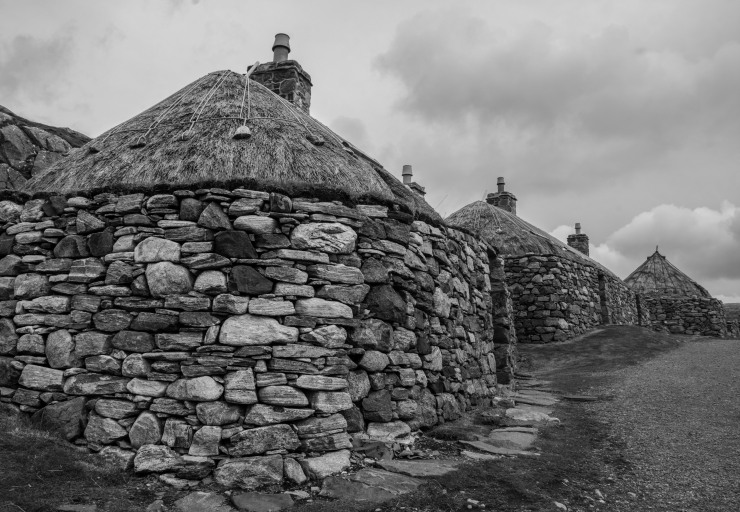 Blackhouses at Gearrannan village. These are centuries-old traditional crofters' houses, used for both livestock and people. Occupied till the 1970s, the blackhouses were given conservation status and preserved after their residents moved to more modern accommodation to avoid the difficult upkeep of drystone and thatchwork. 
