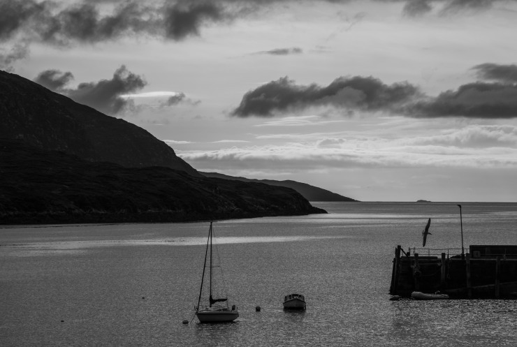 Dusk spreads across the sky over the harbour at Tarbert, the main town on the Isle of Harris. 